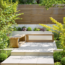 Buchcover mit Titel „Junges Gartendesign – Terrassen und Sitzplätze“, moderne Terrasse mit Steinmauern und Bank.