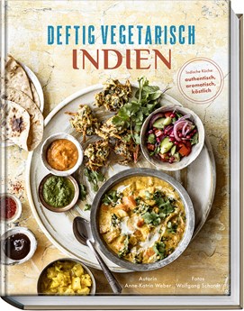 Buchcover „Deftig vegetarisch Indien“ mit vielen Schalen voll Currys, Chutneys und Reis auf hellem Teller.